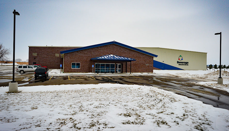Beverage Wholesalers Marshall exterior with front entrance and snowy parking lot