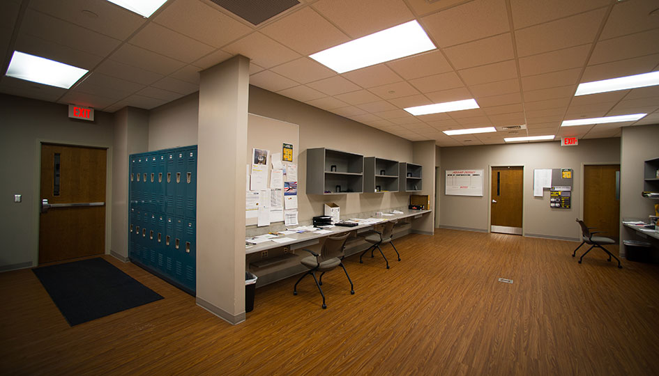 Beverage Wholesalers Marshall office area with lockers, desks, and workstations
