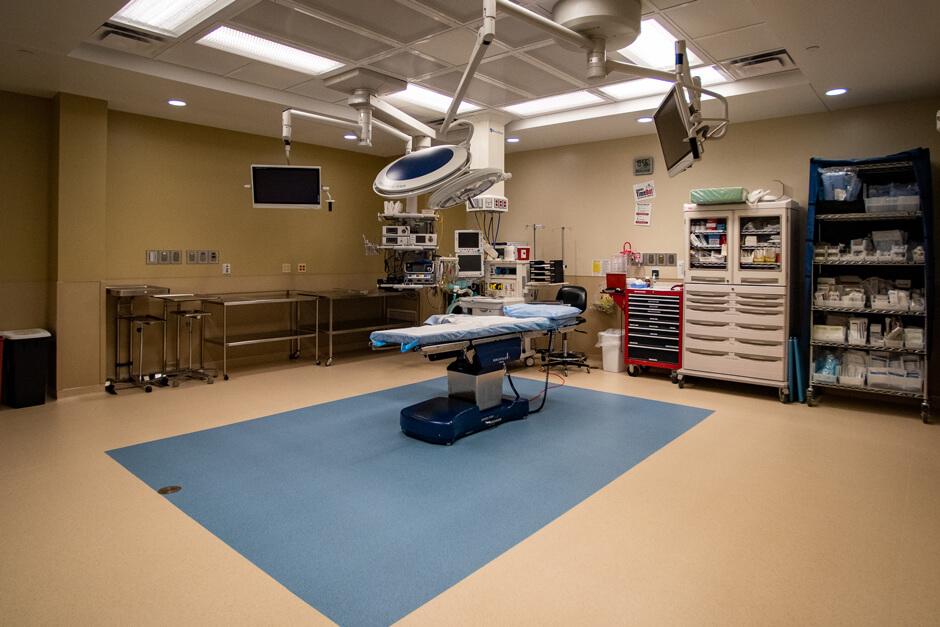 Johnson Memorial Health Services operating room with surgical table and medical equipment