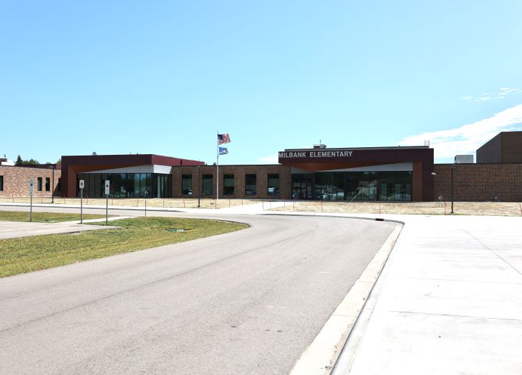 Exterior of Milbank Elementary with front entrance and driveway