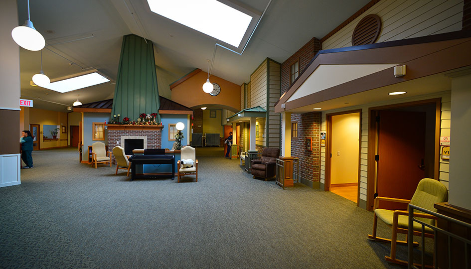 Minnesota State Veterans Home interior lounge with fireplace and resident rooms