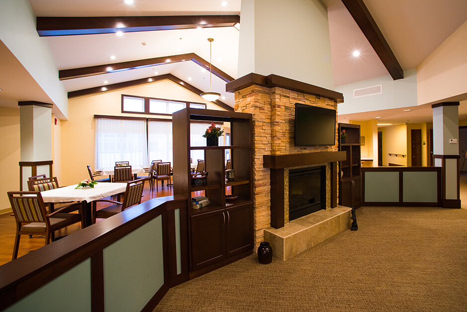 Ortonville Area Health Services interior lounge with fireplace and dining area