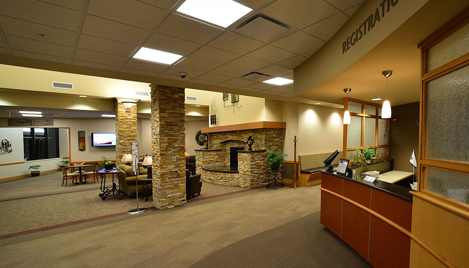 Ortonville Area Health Services registration area with lobby seating and stone fireplace