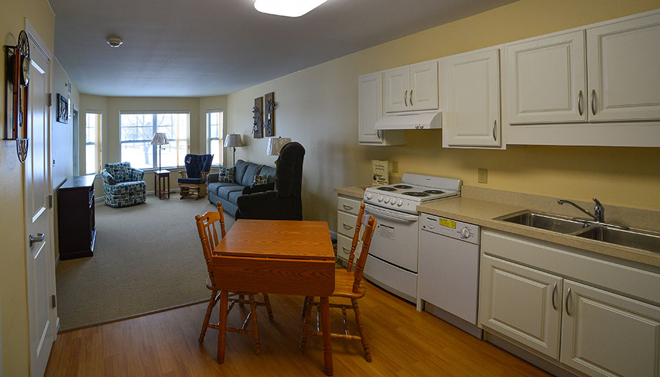 Ortonville independent living apartment with kitchen, dining area, and living room